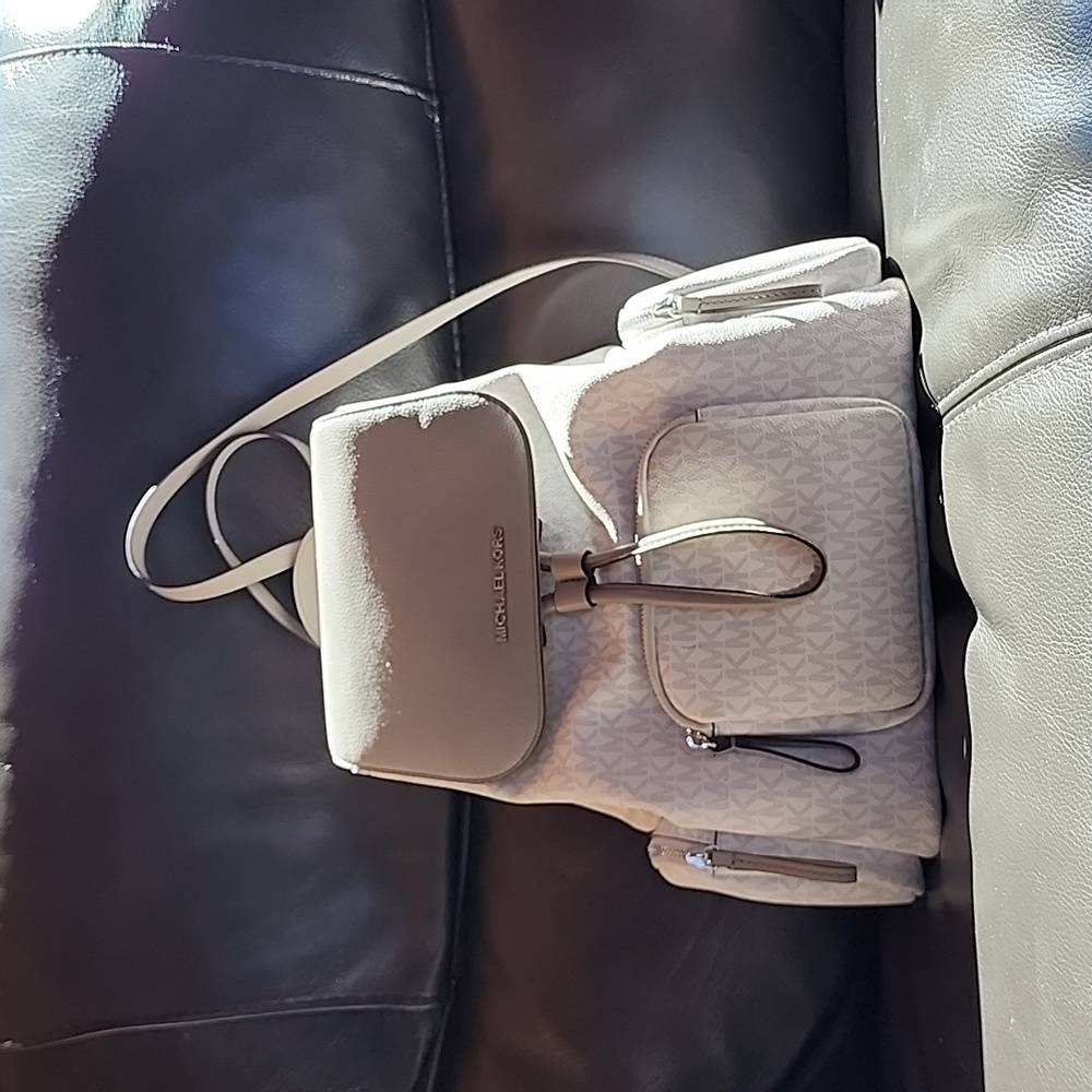 MICHAEL KORS BACKPACK with a couple unnoticeable but NOTED & photographed marks.